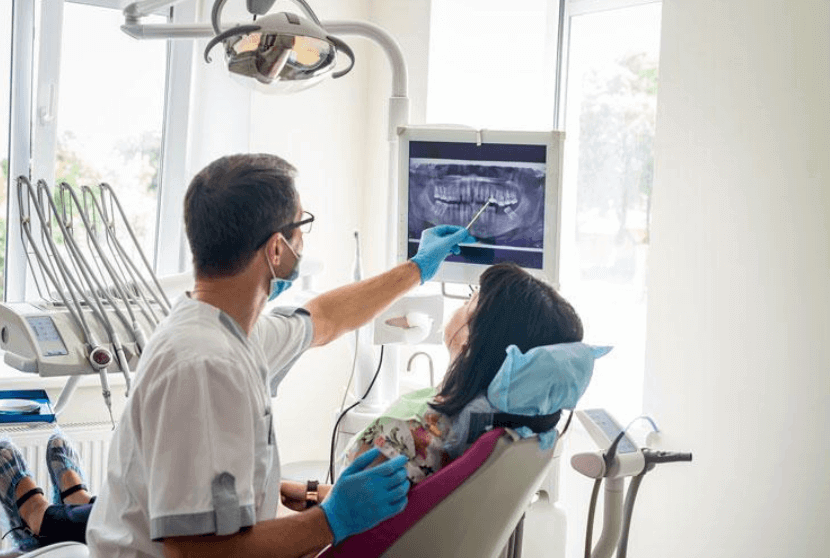 Orthodontist showing dental problems